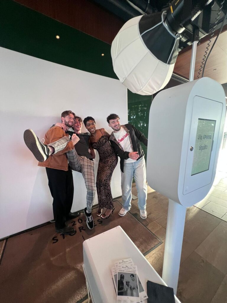 guest posing newspaper photobooth