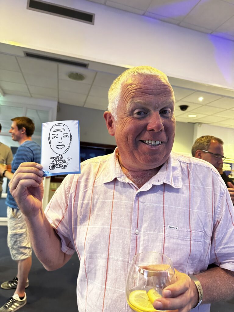 man holding his AI Skethbot drawing