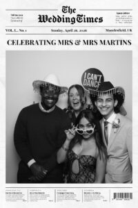 News paper booth guests posing wedding